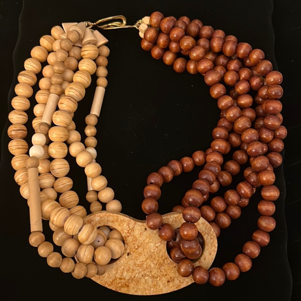 Wooden needed necklace with stone medallion